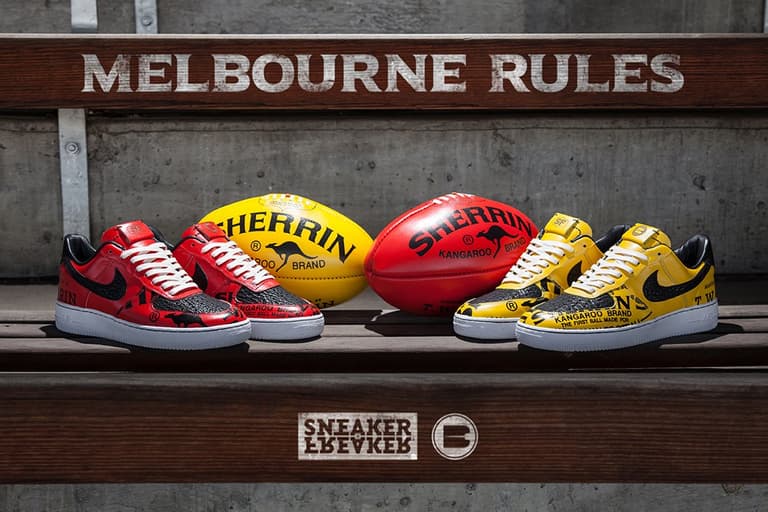 Custom Nike Air Force 1 sneakers in red and yellow with Sherrin footballs on a wooden bench.