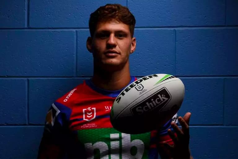 Kalyn Ponga with a football
