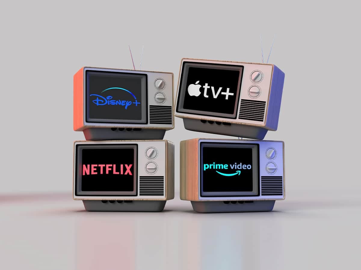 Stacked retro televisions displaying logos for Disney+, Apple TV+, Netflix, and Prime Video on screens.