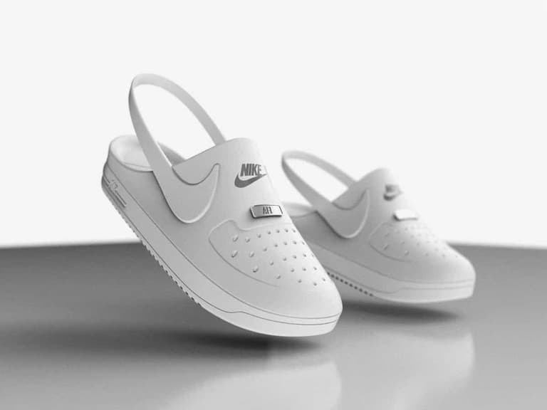 Crocs x Nike Air Force 1 clog hybrids in white, featuring perforated design and Nike branding.