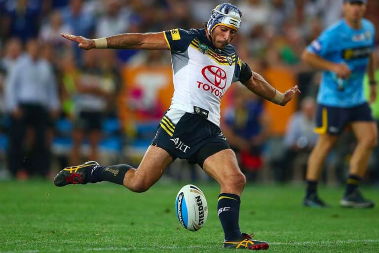 A footballer kicking a ball