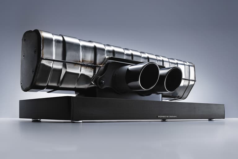 Porsche 911 Soundbar featuring exhaust pipe design on sleek black base.