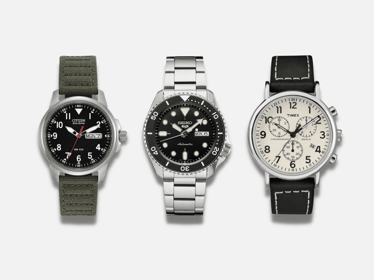 Citizen watch with green fabric strap, Seiko diver's watch with stainless steel bracelet, Timex chronograph with black leather strap.