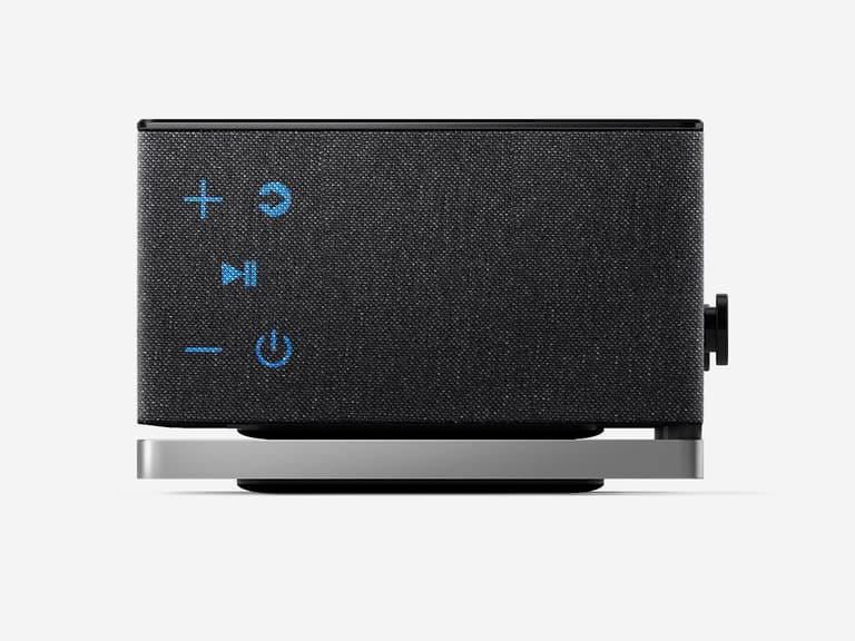 Porsche Design Soundbar 3 in black with blue control icons on a sleek silver base.