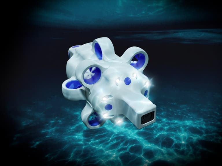 Advanced Navigation Hydrus subsea drone with white and blue design, illuminated underwater setting.