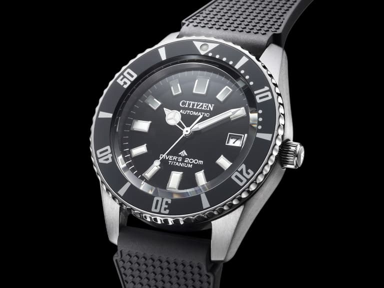 Citizen Promaster Mechanical Diver 200M watch with black dial and titanium case on black rubber strap.