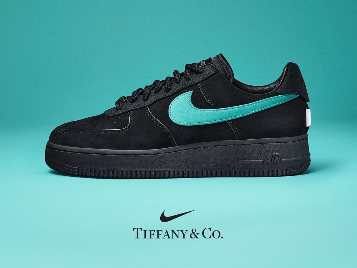 Tiffany & Co. x Nike Air Force 1 sneaker in black suede with teal swoosh on turquoise background.