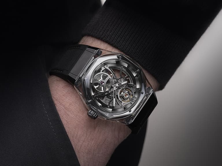 Girard Perregaux Laureato Absolute watch with transparent case on wrist, showcasing intricate mechanics.
