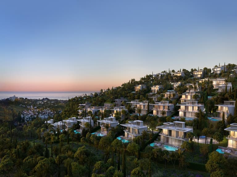 Lamborghini Tierra Viva villas in Spain at sunset, featuring modern architecture and private pools amidst lush greenery.
