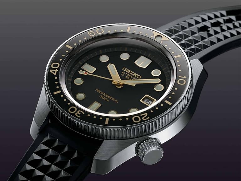 Seiko watch with black dial and rubber strap, featuring bold hour markers and a rotating bezel.