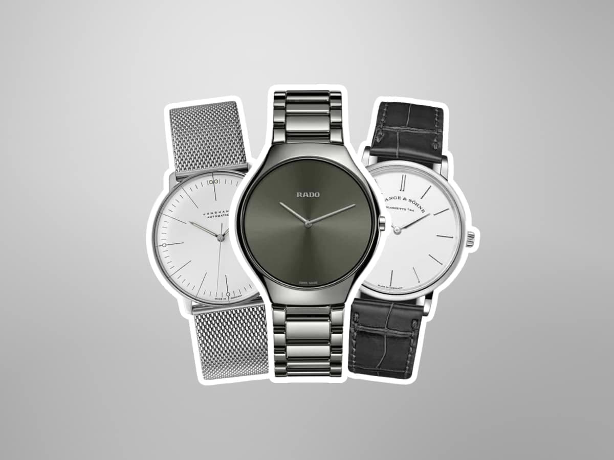Rado, Skagen, and Junghans minimalist watches with silver and black straps on a grey background.