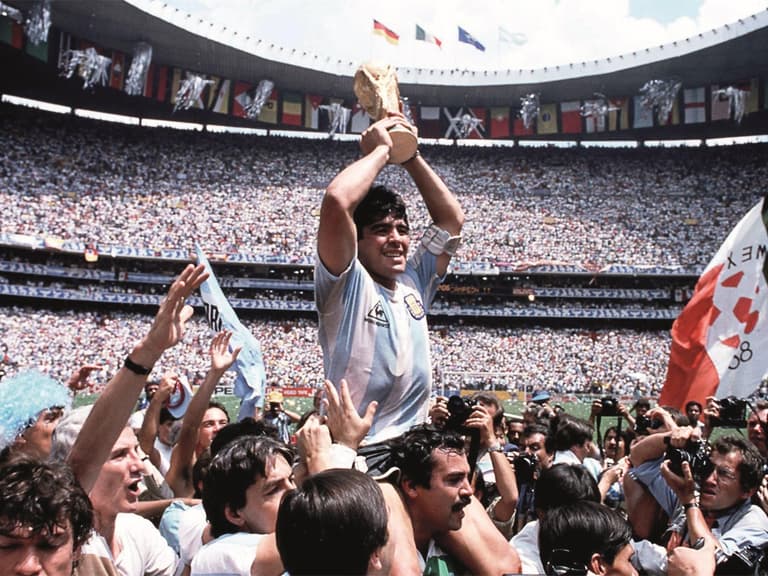 Maradona being carried on shoulder with FIFA trophy
