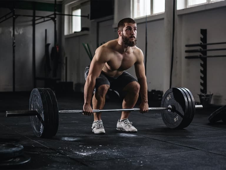 Man in a deadlift form