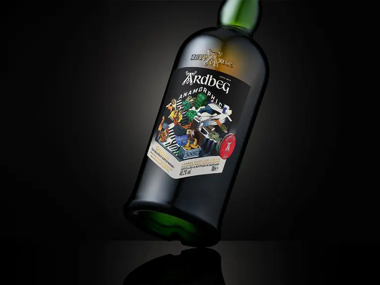 Ardbeg Anamorphic whisky bottle against a dark background with intricate label design.