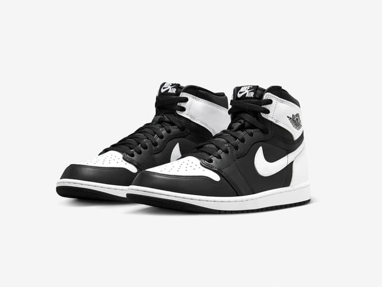 Nike Air Jordan 1 High OG sneakers in black and white, angled view showing side and front.