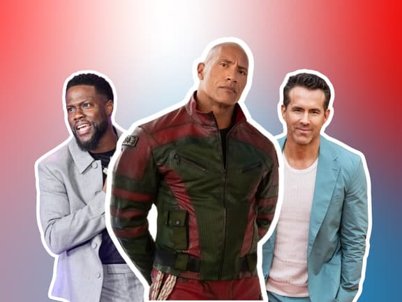 Kevin Hart, Dwayne Johnson, and Ryan Reynolds stand together against a red and blue gradient background.