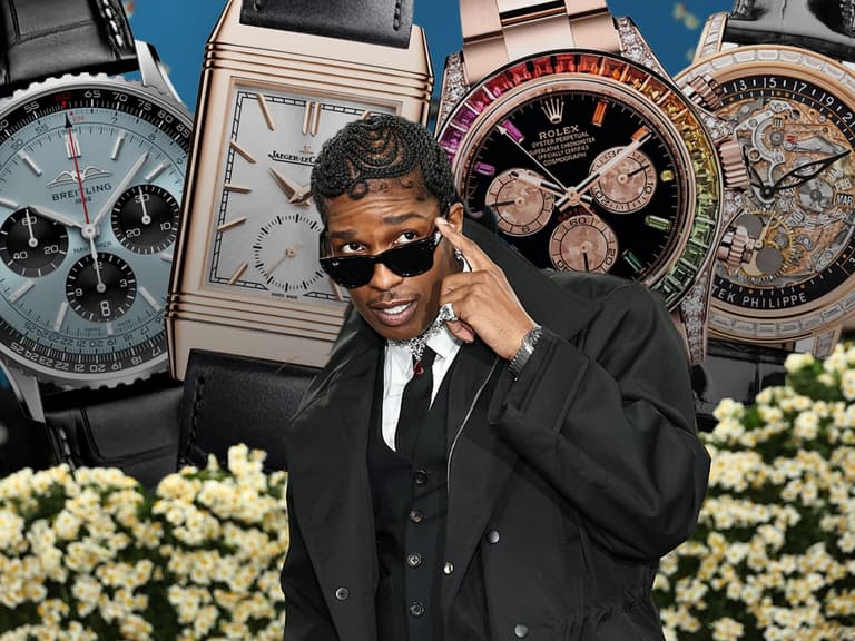 Man in black suit poses with four luxury watches, including Breitling, Jaeger-LeCoultre, Rolex, and Patek Philippe.