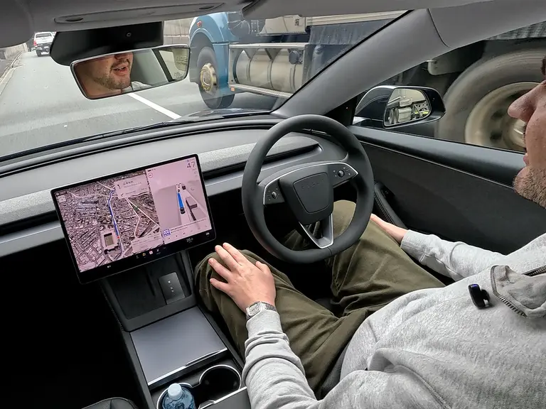 Tesla full self driving supervised in car