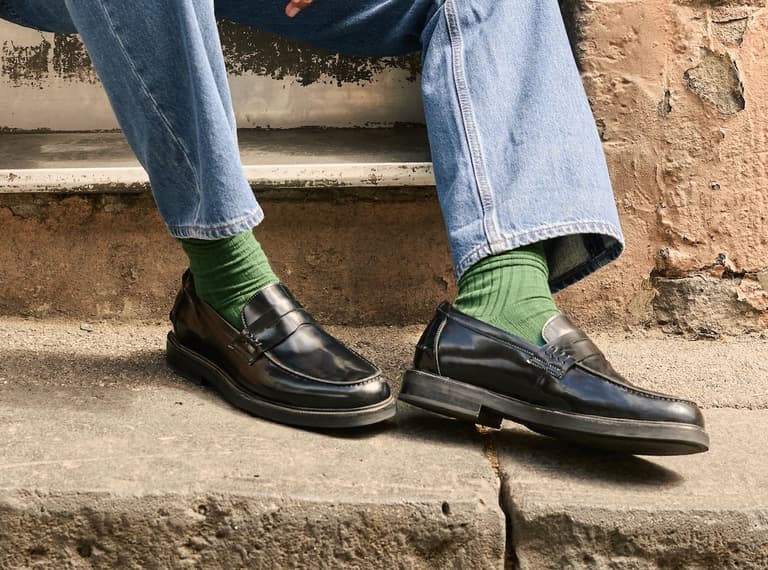 bared footwear loafer with jeans and green socks